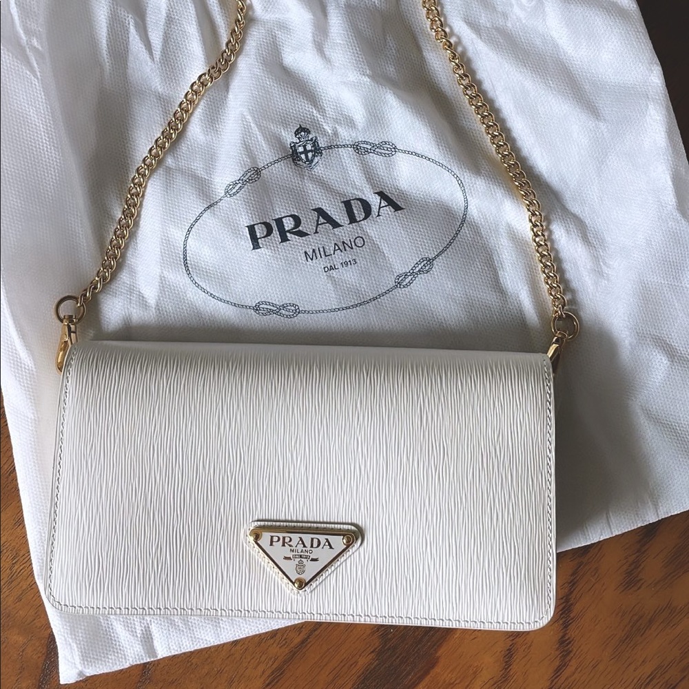 Prada white WOC with gold hardware. New with dust bag. Excellent condition